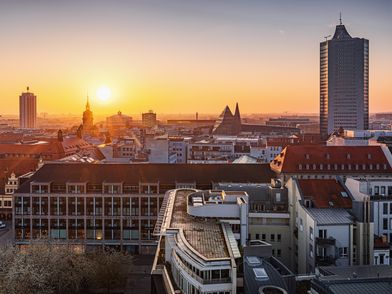 Tagung & Konferenz Leipzig Convention: Sonnenuntergang über den Dächern der Stadt